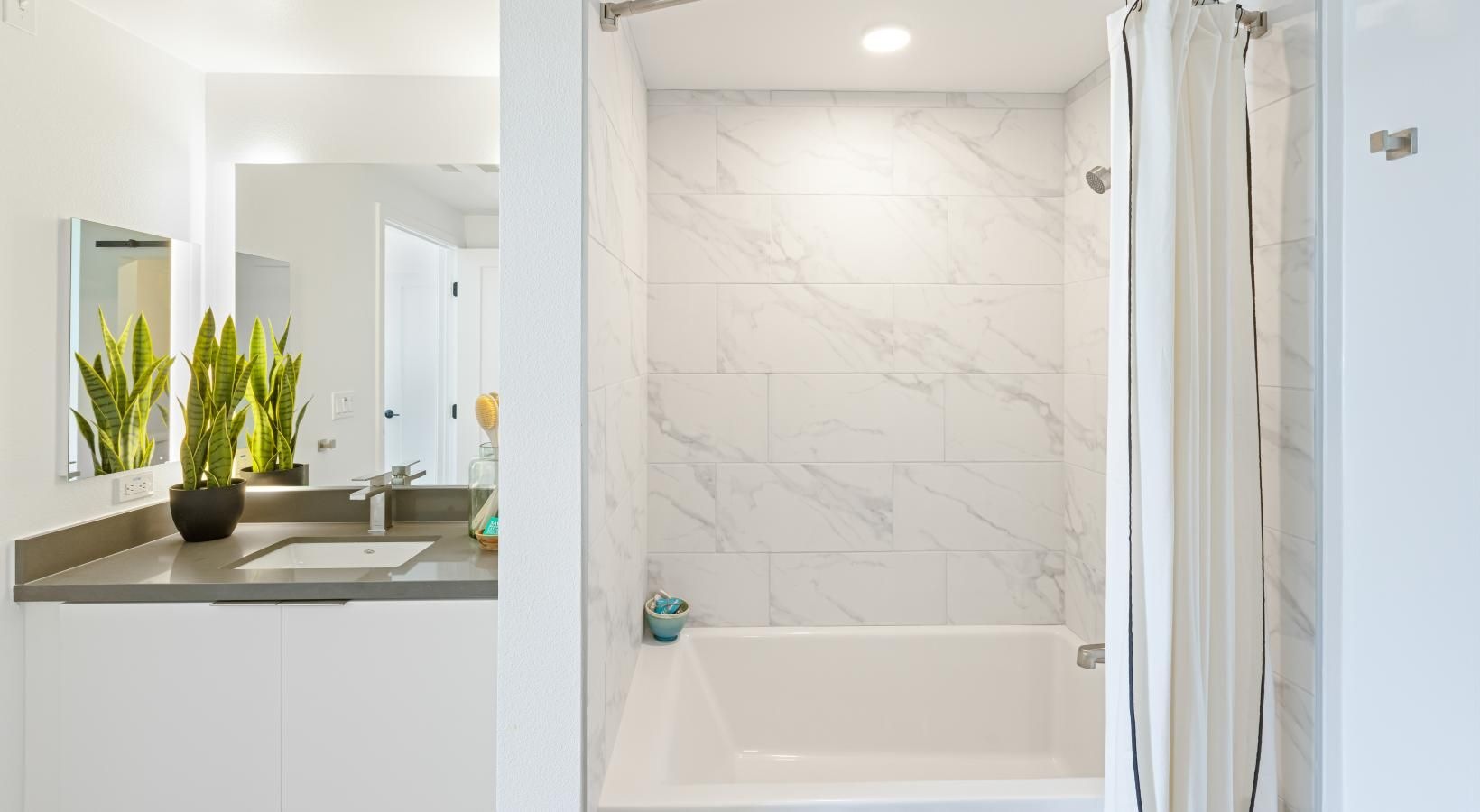 Spacious bathrooms with everything you need a bathroom with a tub, sink and shower