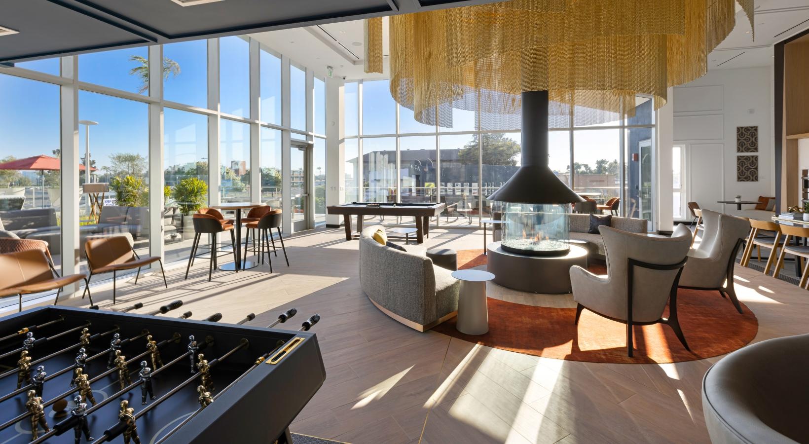 Take advantage of all Winslow has to offer a room with a large window and a large table with chairs