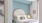 a bed with a white headboard
