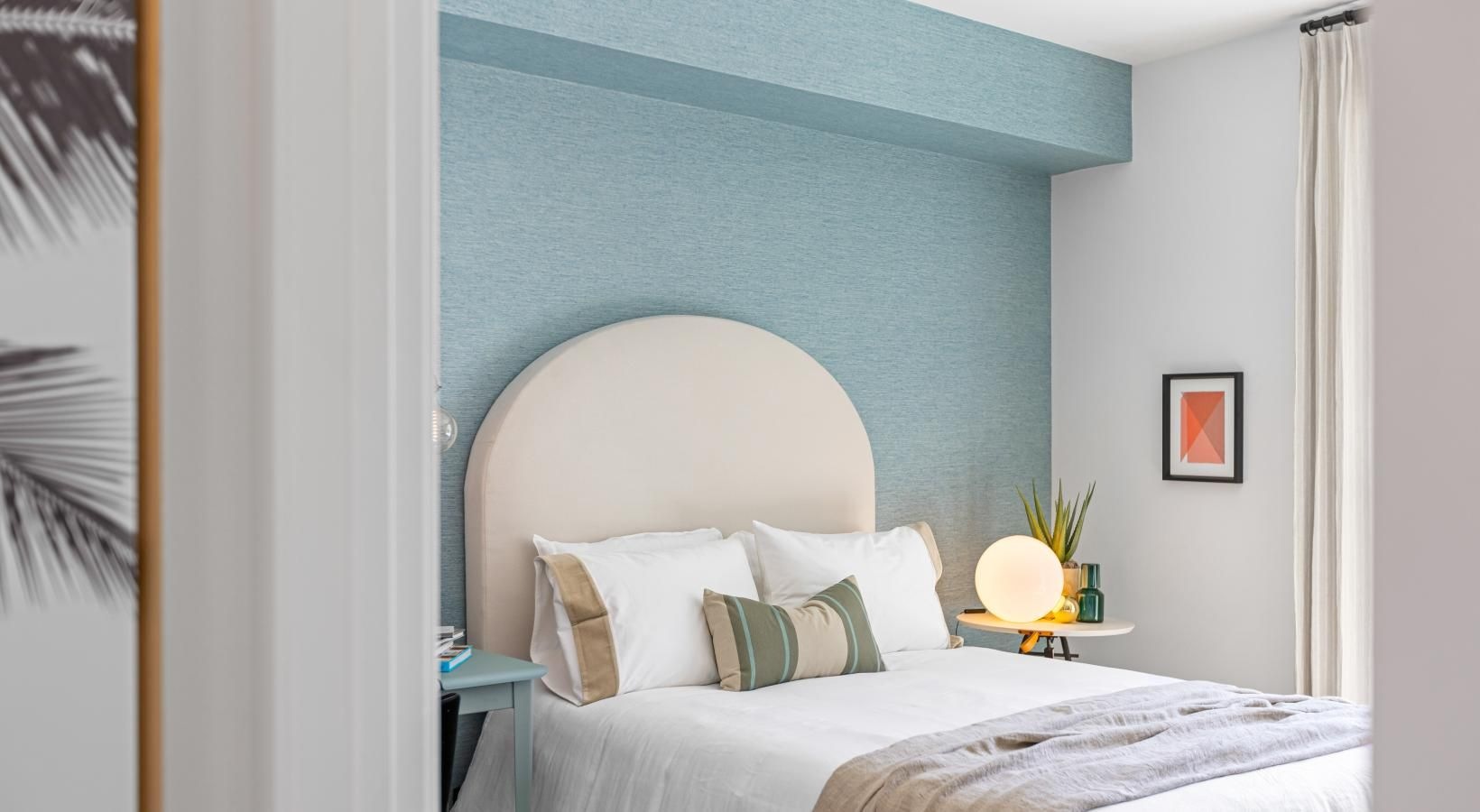 Generous bedroom offerings to fit every family a bed with a white headboard