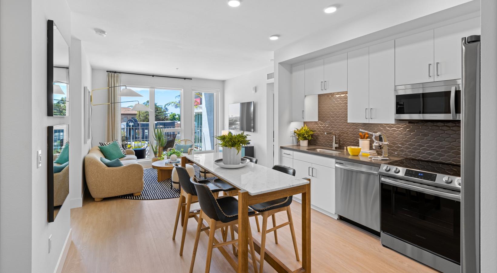 Beautiful kitchens with designer finishes a kitchen with a dining table