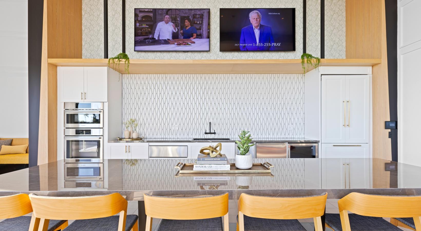 Access to resident-only features a kitchen with a table and chairs