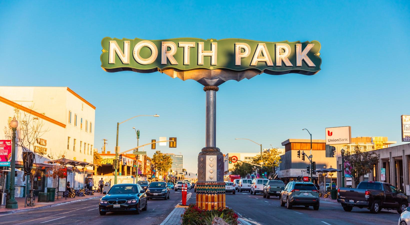 Settle into comfort at Winslow a street with cars and buildings on either side of it