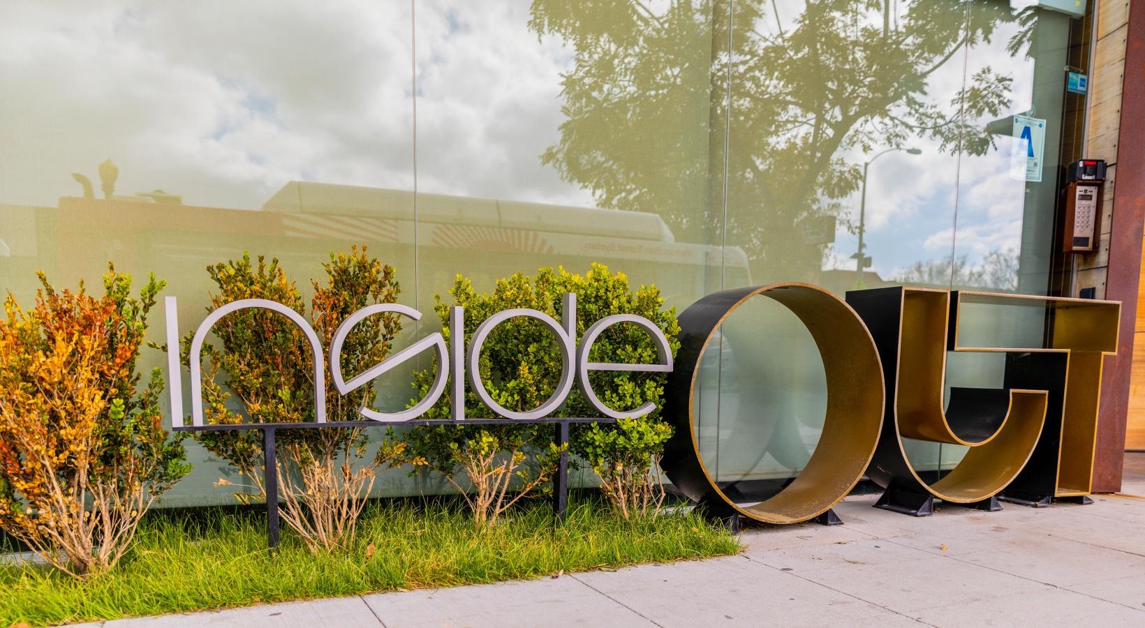 The essence of exceptional living a local retailer with a sign