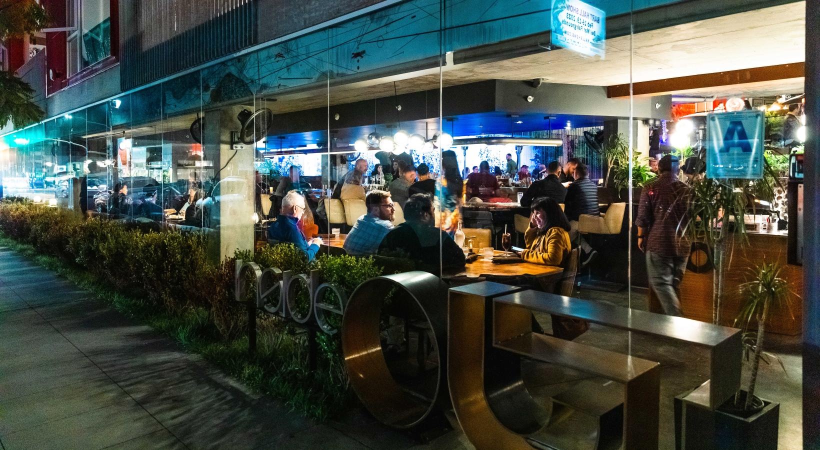 The essence of exceptional living a group of people sitting at tables