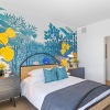 a bedroom with a bed and two nightstands