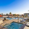 two swimming pools in an outdoor lounge area