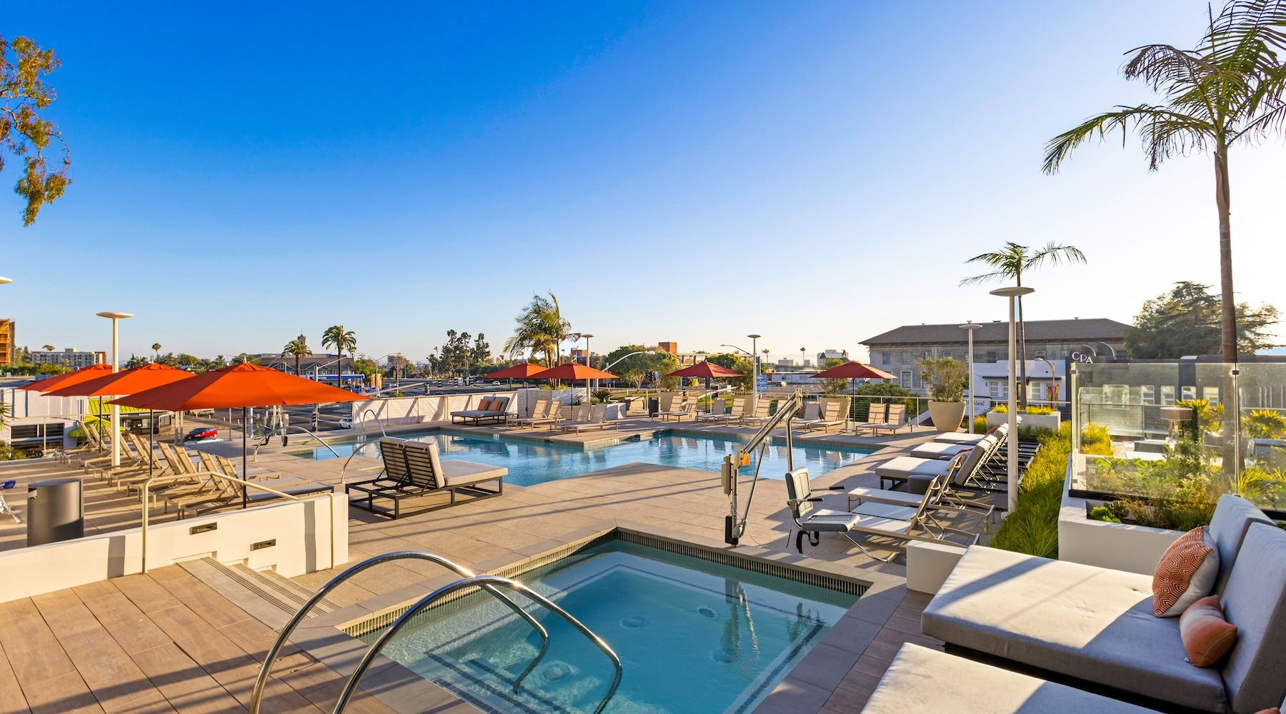 Relax and unwind poolside two swimming pools in an outdoor lounge area