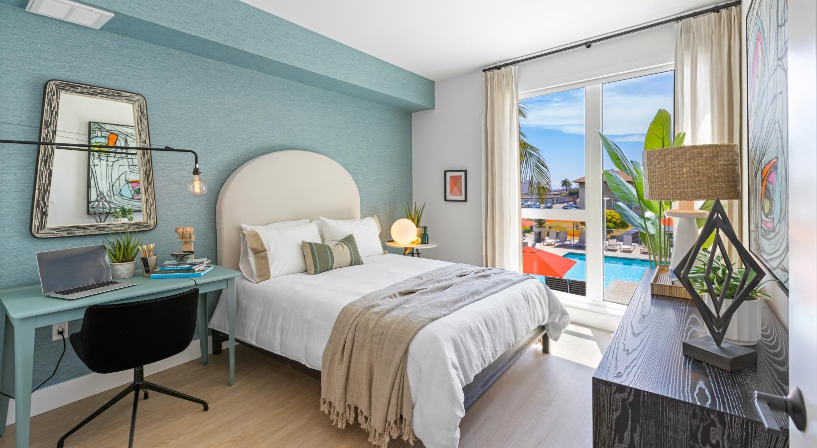 Relax and recharge in beautiful and spacious bedrooms a bedroom with a large window