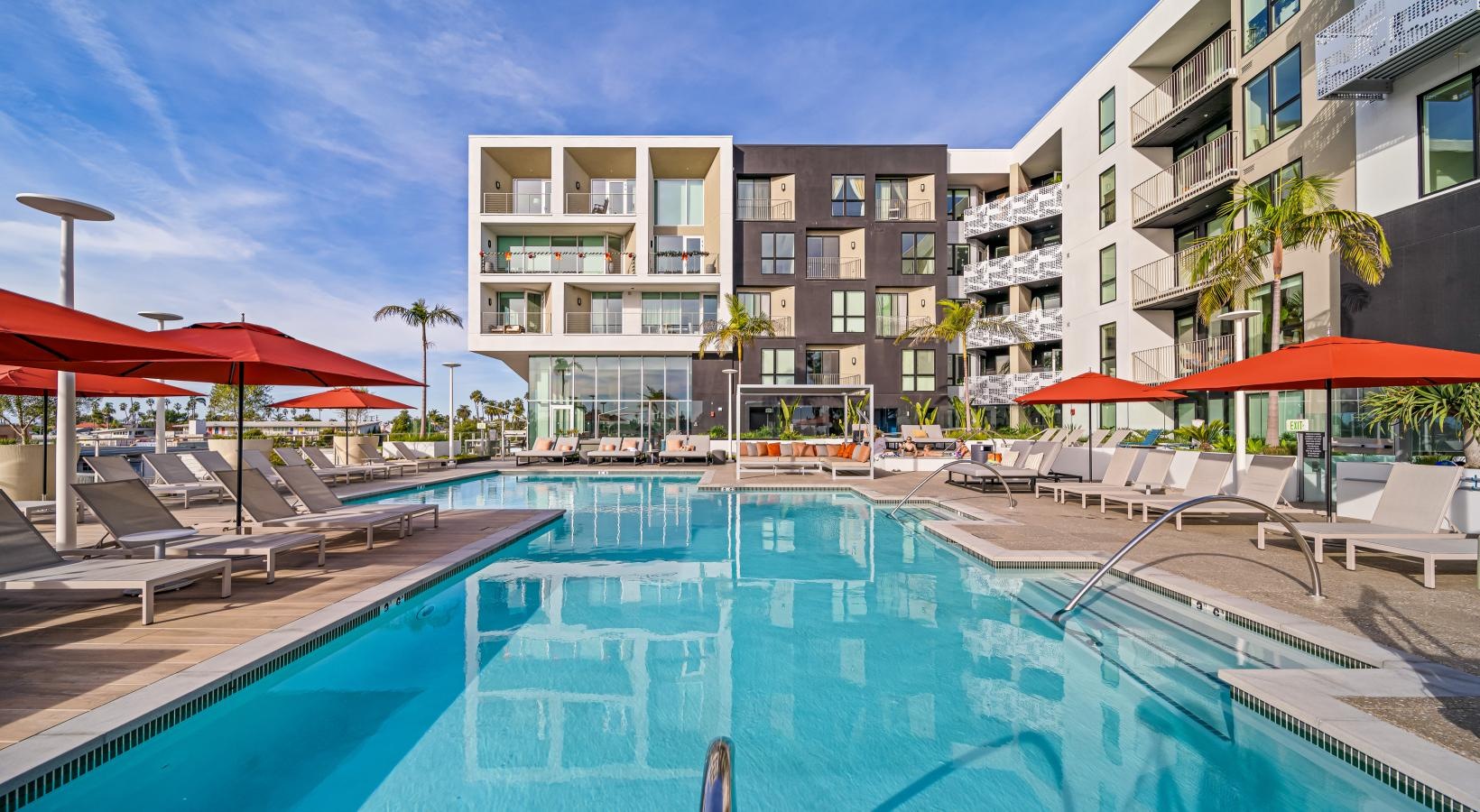 The essence of exceptional living a pool with a building in the background