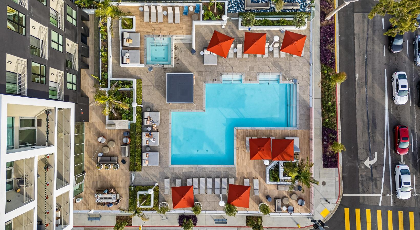 Settle into comfort at Winslow an aerial view of a building with a rooftop pool