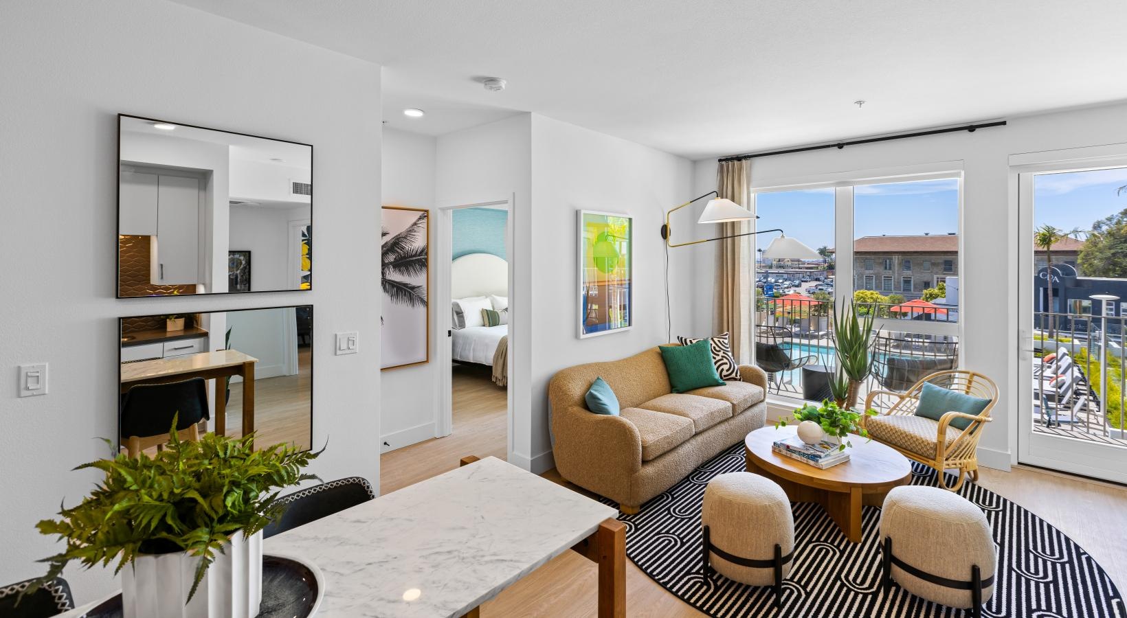 Wide open living areas flooded with natural light a living room with a large window