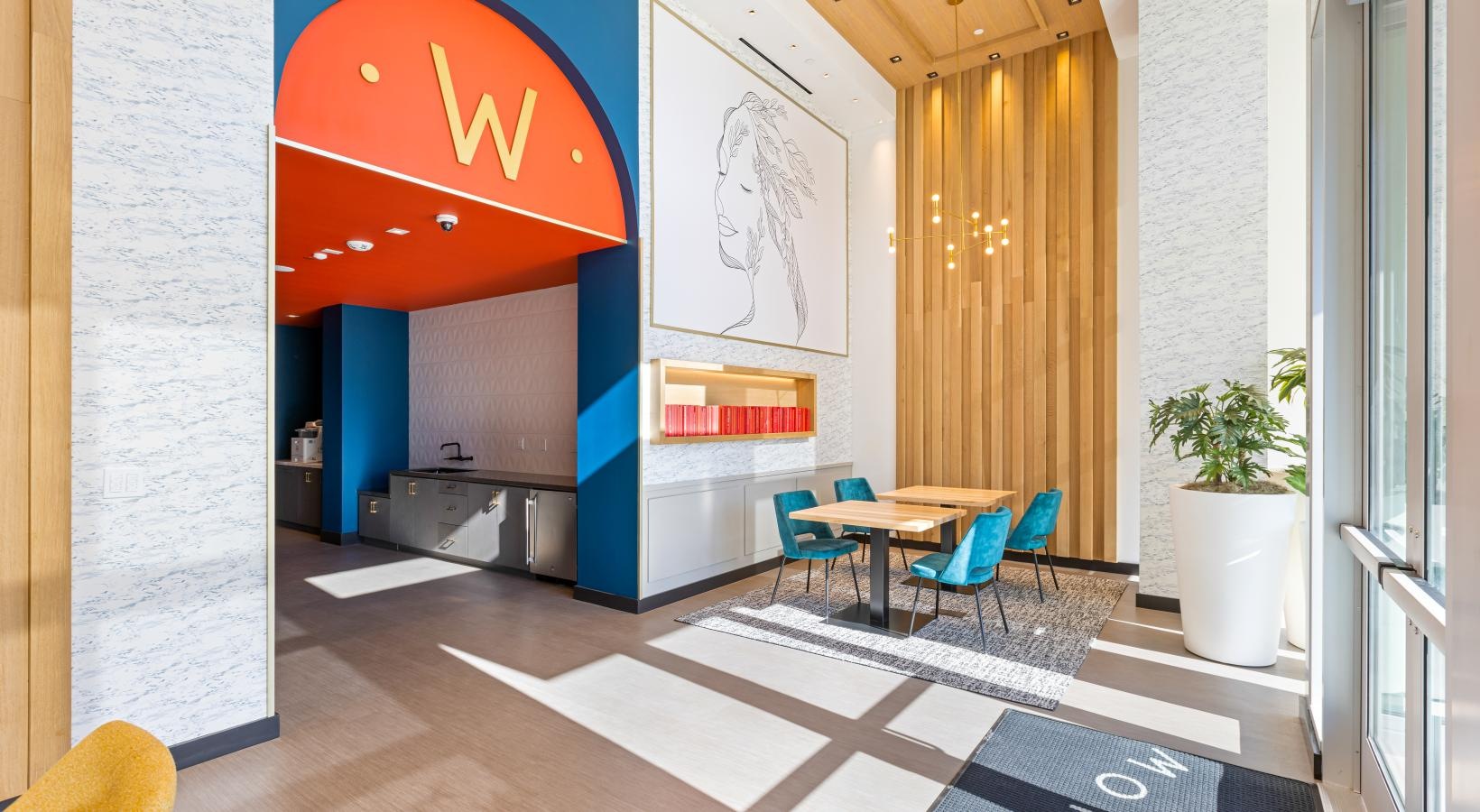 Access to resident-only features a room with a table chairs and a sign on the wall