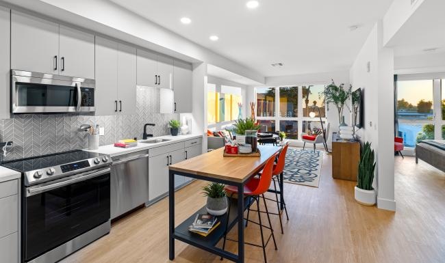 Find your perfect fit at Winslow a kitchen with a table and chairs