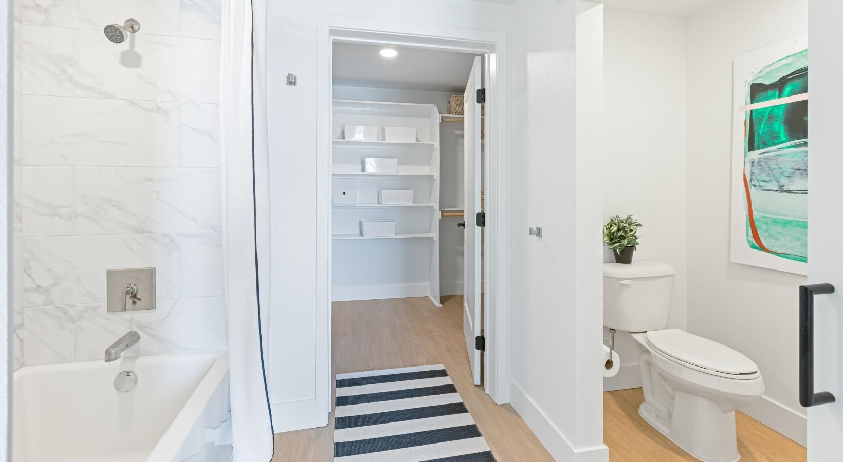 Spacious bathrooms with everything you need a bathroom with a tub, toilet, and sink