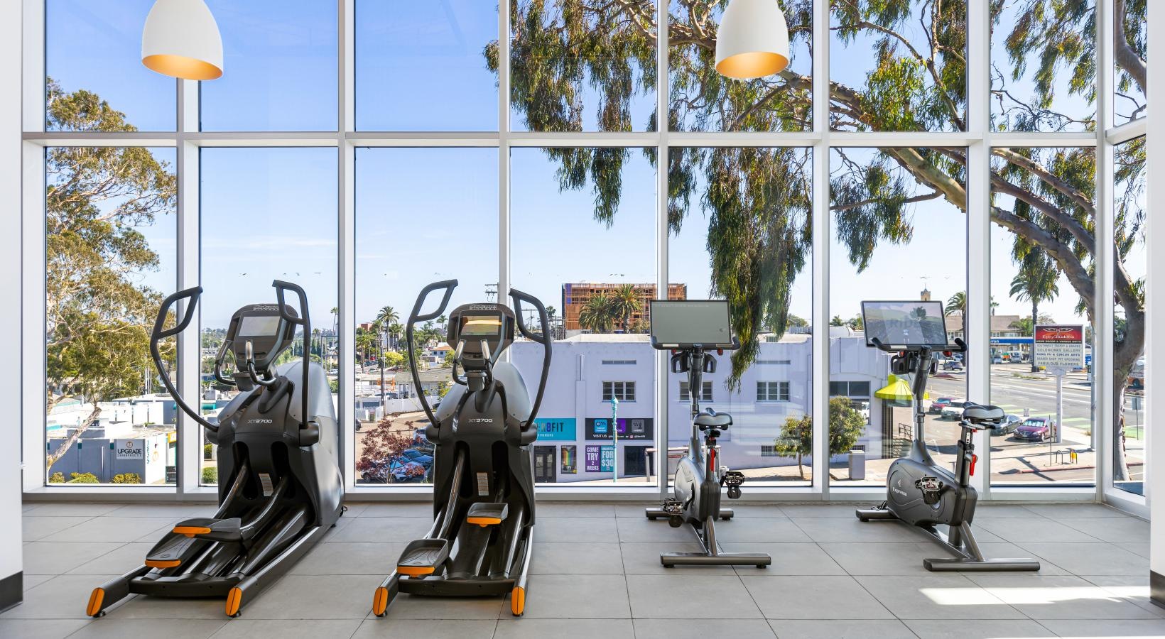 State-of-the-art amenities a gym with exercise equipment